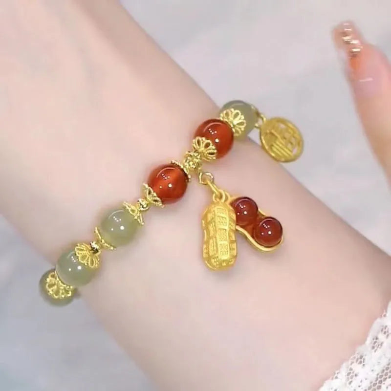 Chinese style glass bead bracelet with bamboo leaf design and manual craftsmanship details.