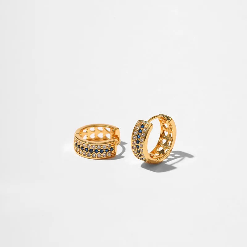 A pair of round, geometric copper earrings with an 18K electroplated gold-colour finish.