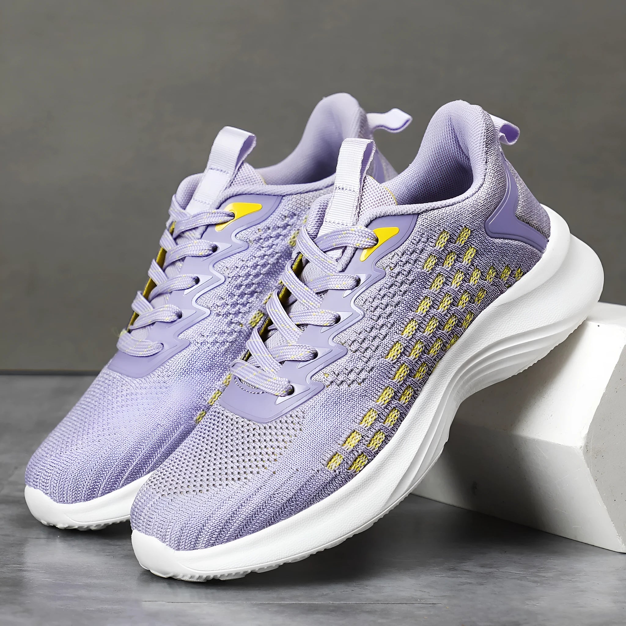 Lavender purple women's Flyknit running shoes with striped pattern and EVA sole.