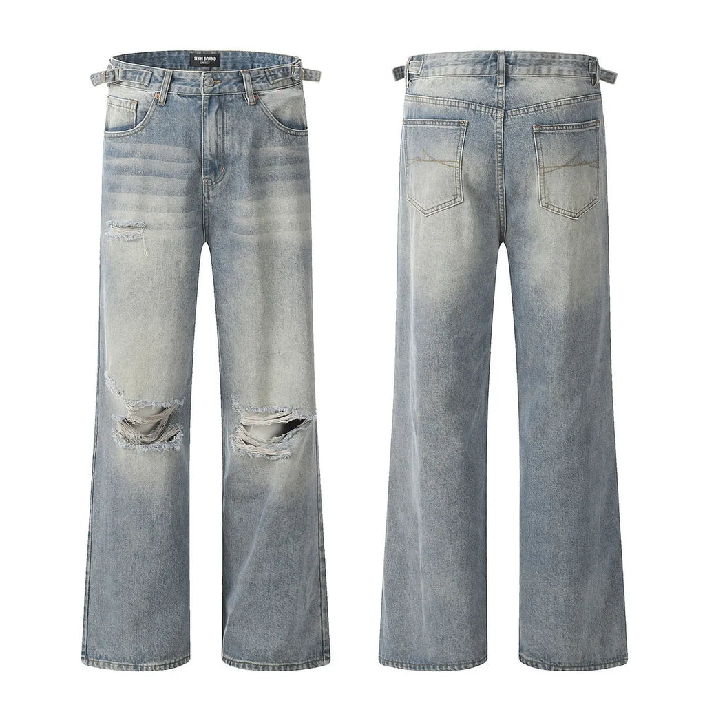 Men's blue distressed straight-leg retro jeans with a zip fly on a plain background.