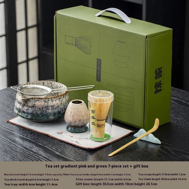 Seven-piece Japanese style matcha set with ceramic bowl, bamboo whisk, stand, tea tray, filter screen, and tea towel in gift box