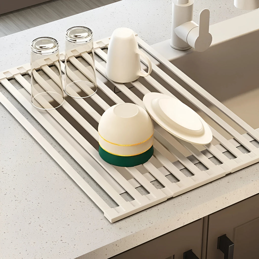 Foldable milky white stainless steel kitchen draining rack shown open and folded, next to a sink.