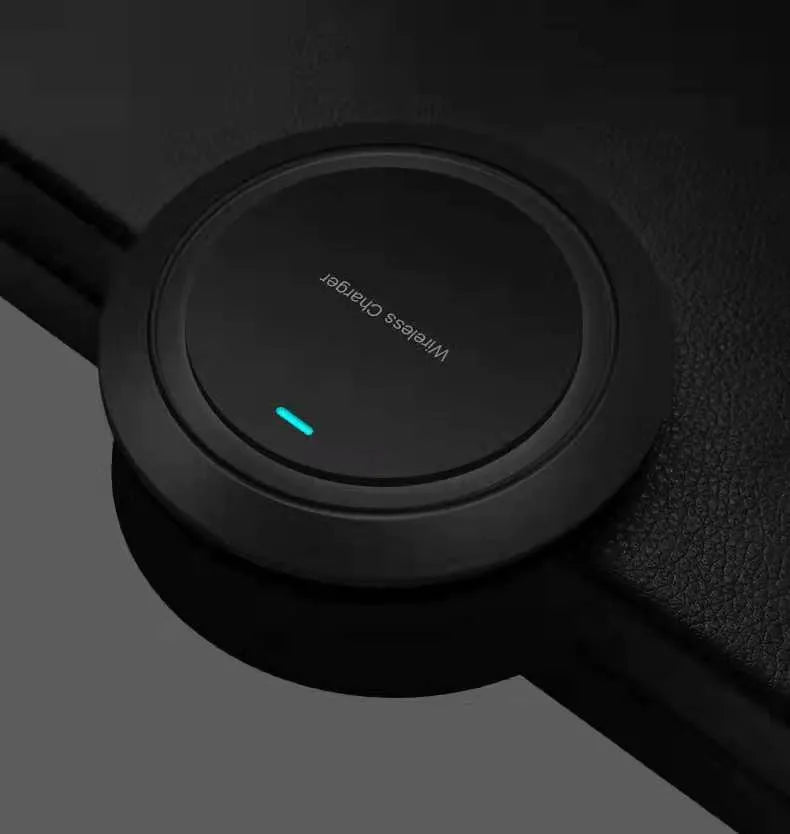 Round white desktop wireless charger with USB cable showing 10W fast charging for mobile phones