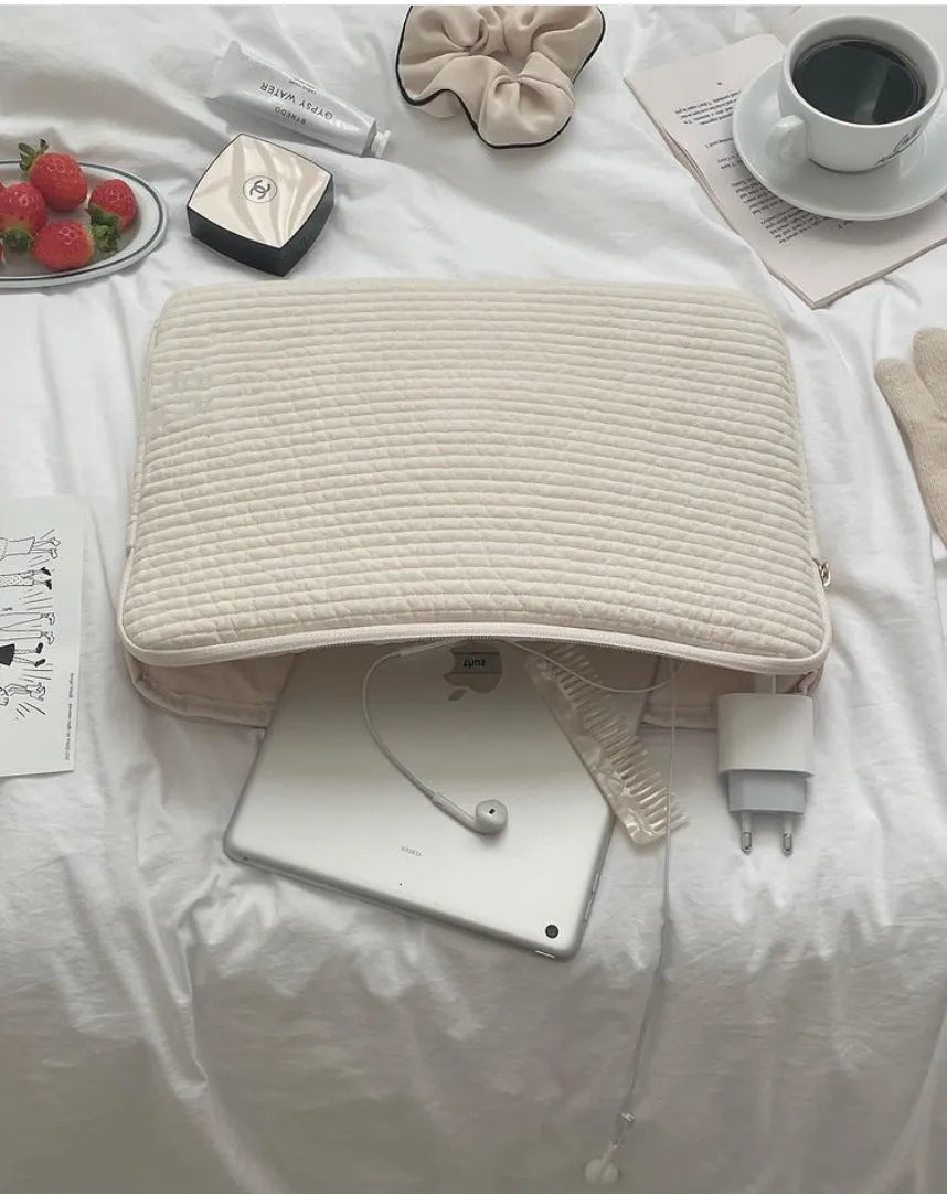 Black and white cotton cloth hand-held clutch bag for anti-seismic tablet protection.
