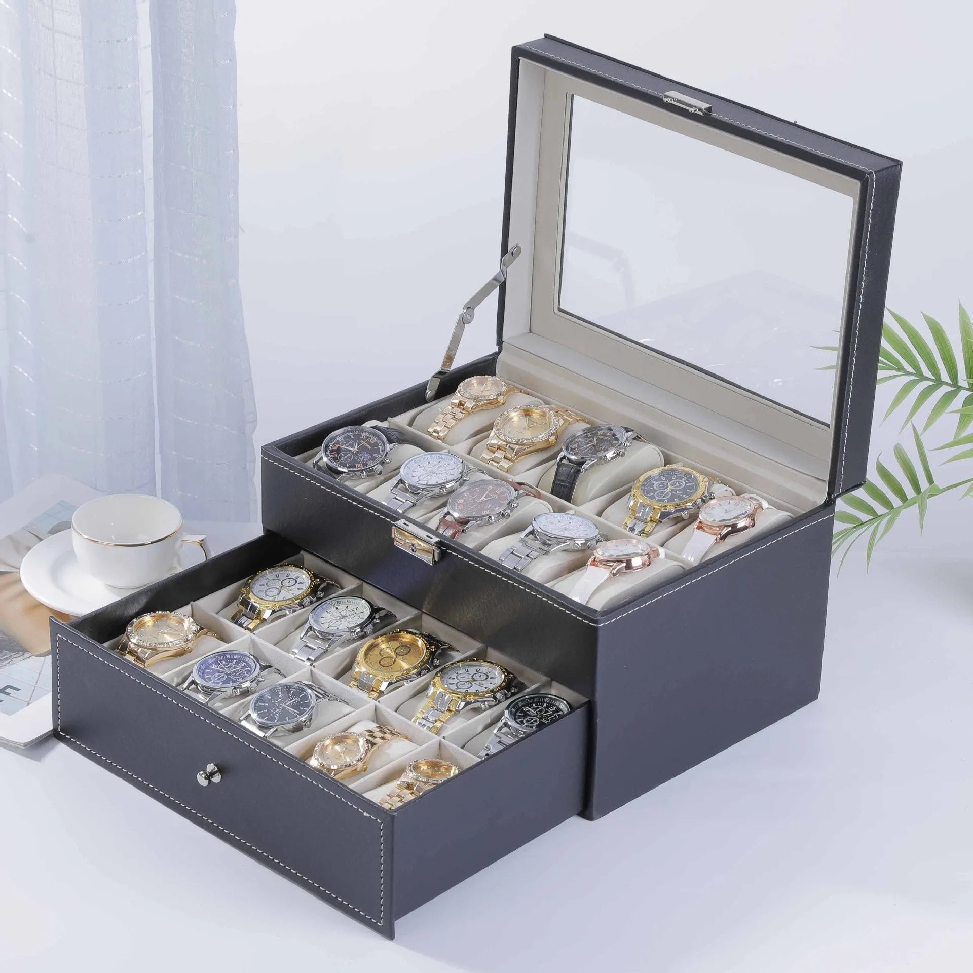Grey leather watch storage box with clear dustproof lid showing multiple watch slots inside.