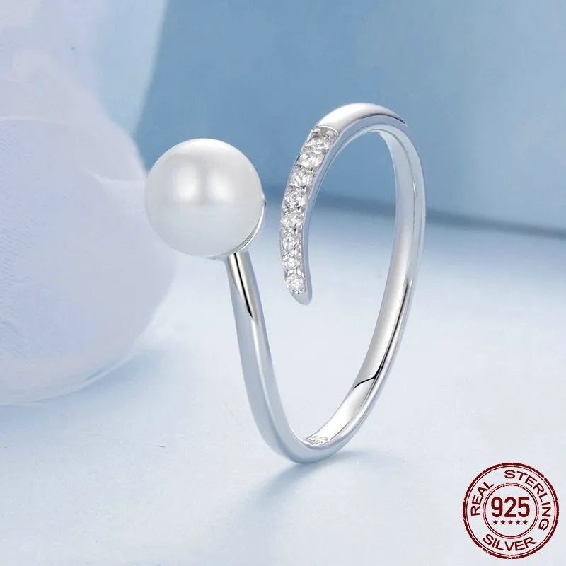 S925 sterling silver adjustable ring with natural shell pearl centrepiece showing open loop design