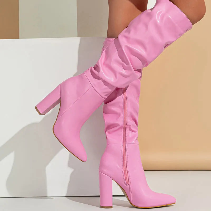 Women's white and pink pointed toe high heel boots with side zipper and mesh lining.