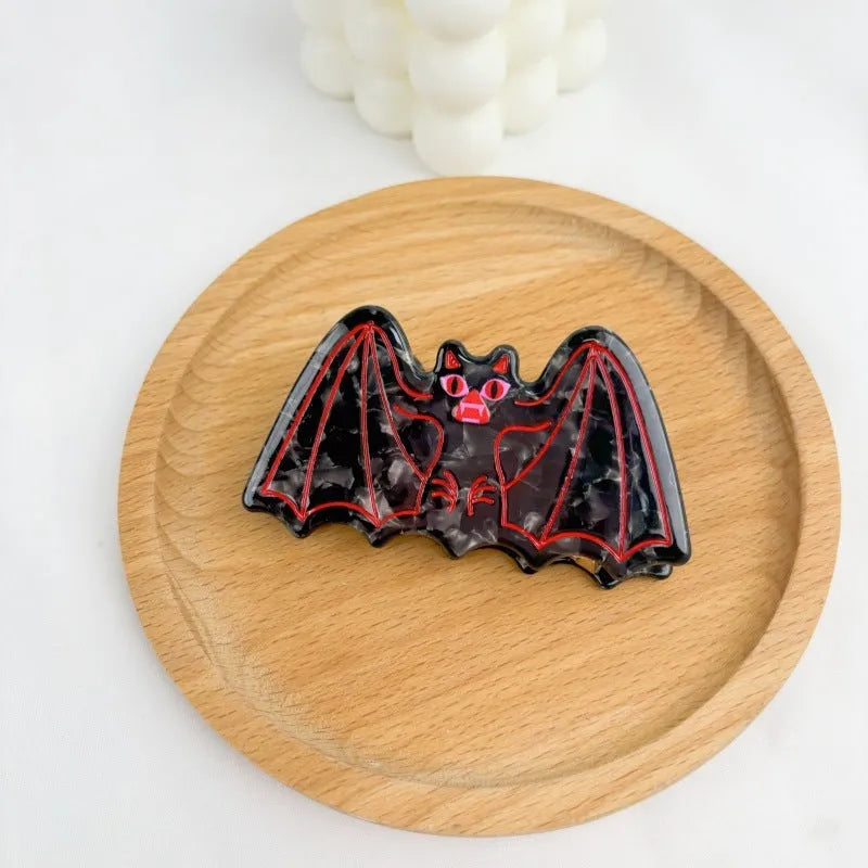 Halloween shark vinegar bat hair clip with bat design elements in four colour options