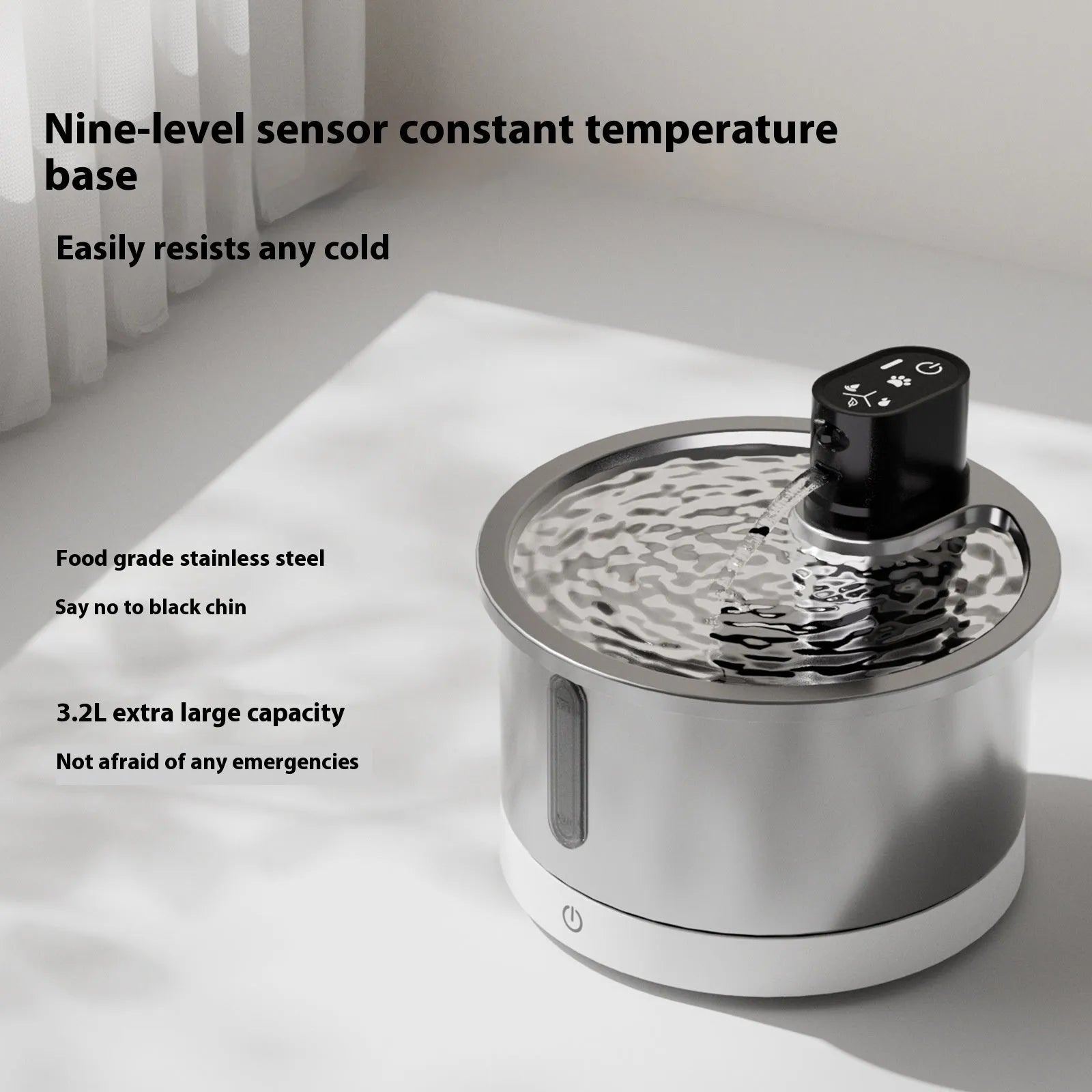 Stainless steel cat and dog water fountain with white heating base on a kitchen floor.