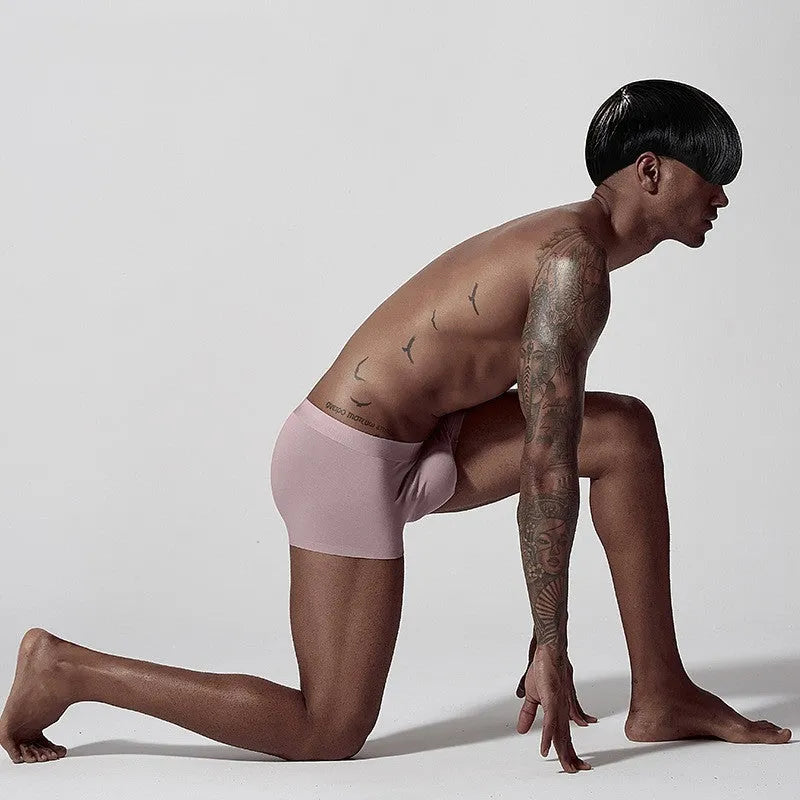 Seamless men's modal underwear in green colour showing mid-waist design and solid colour construction