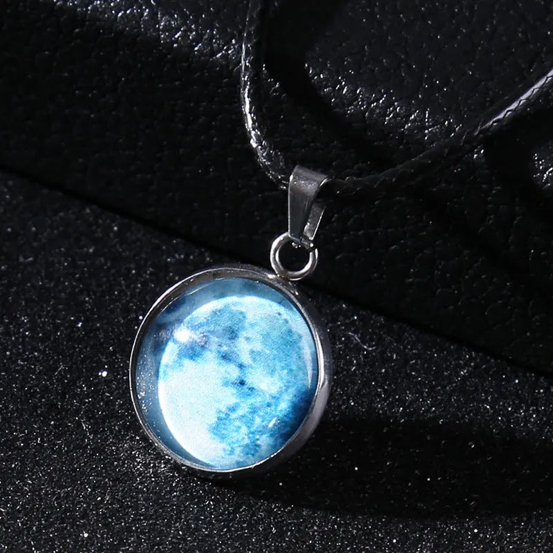 Luminous alloy necklace with a glass pendant depicting a Christmas moon night sky, showing the extension chain.