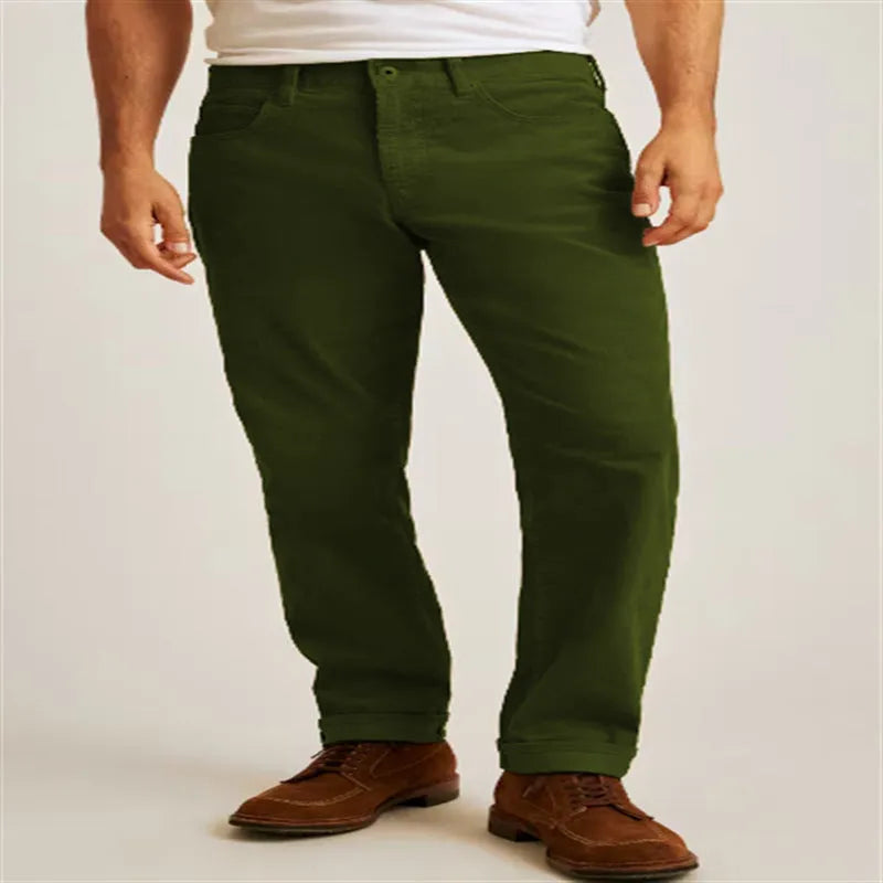 Straight leg corduroy casual trousers in army green colour showing mid waist and zip placket detail.