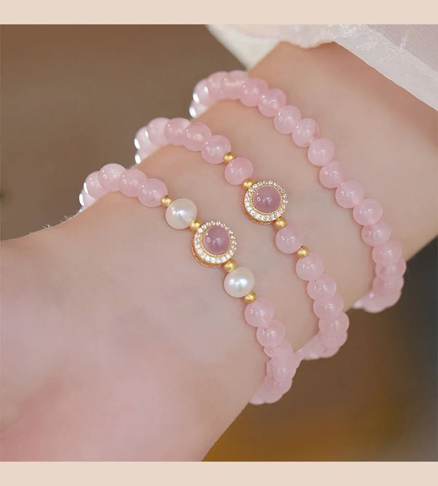 Women's copper bracelet with pink crystal pearls and golden balls, natural style jewellery.
