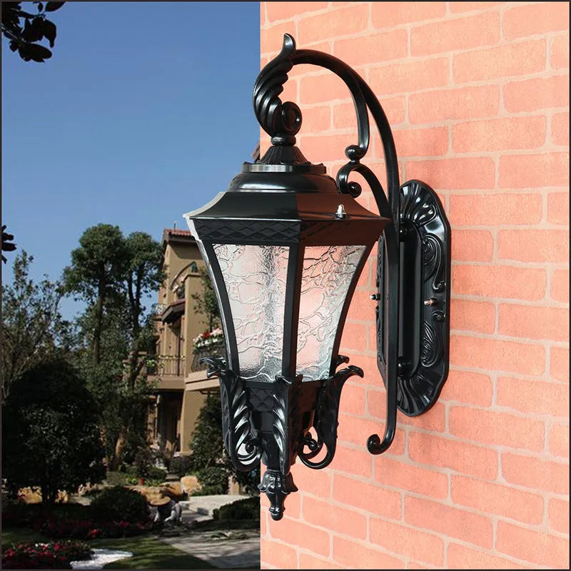 European-style black outdoor wall lamp with solar panel mounted on exterior wall