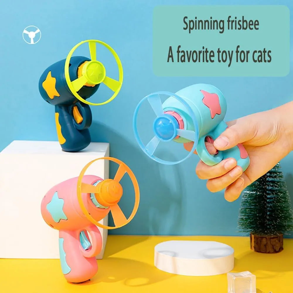 Blue plastic cat toy gun with disc launcher and Frisbee for indoor feline play