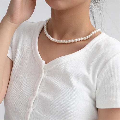 White round alloy pendant necklace for women on a plain background