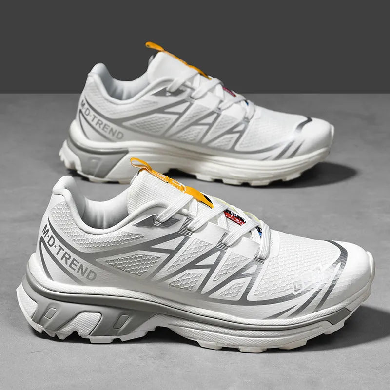 Low-top outdoor hiking shoes in artificial leather with mesh lining and rubber sole.