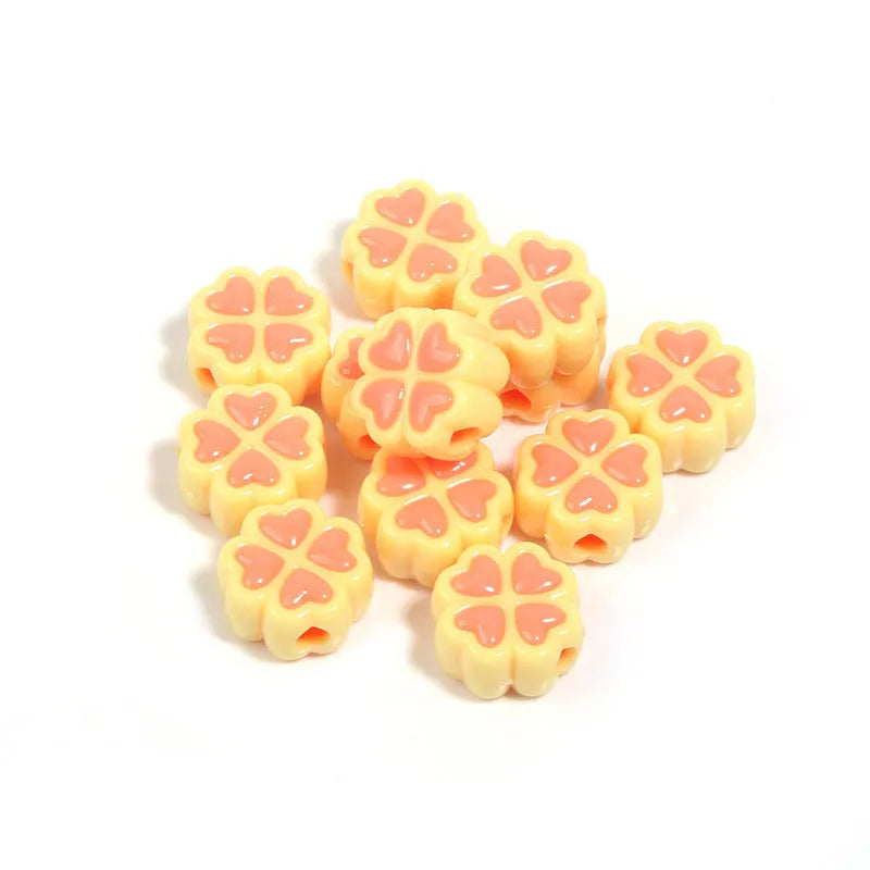 15mm acrylic four-leaf clove beads in light colours including rose red, pink, yellow, green, blue, and purple with frosted finish