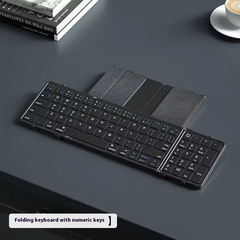 Black folding Bluetooth keyboard unfolded showing keys and touchpad option