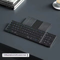 Black folding Bluetooth keyboard unfolded showing keys and touchpad option