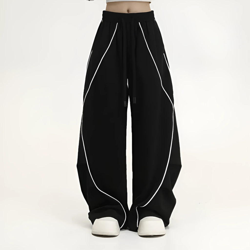 Black pleated wide-leg hip hop trousers with stripes, loose fit for sports.