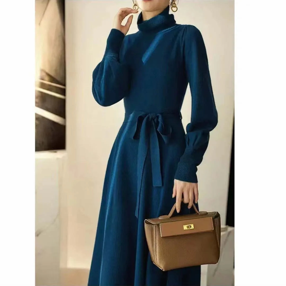 Rose red loose fit turtleneck knitted dress with long sleeves and a midi-length skirt.