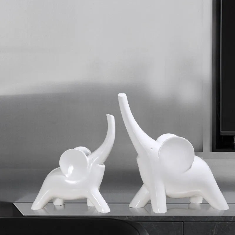 Modern resin and plastic elephant ornament in rose gold or white colour, available in large, small, or pair sizes.