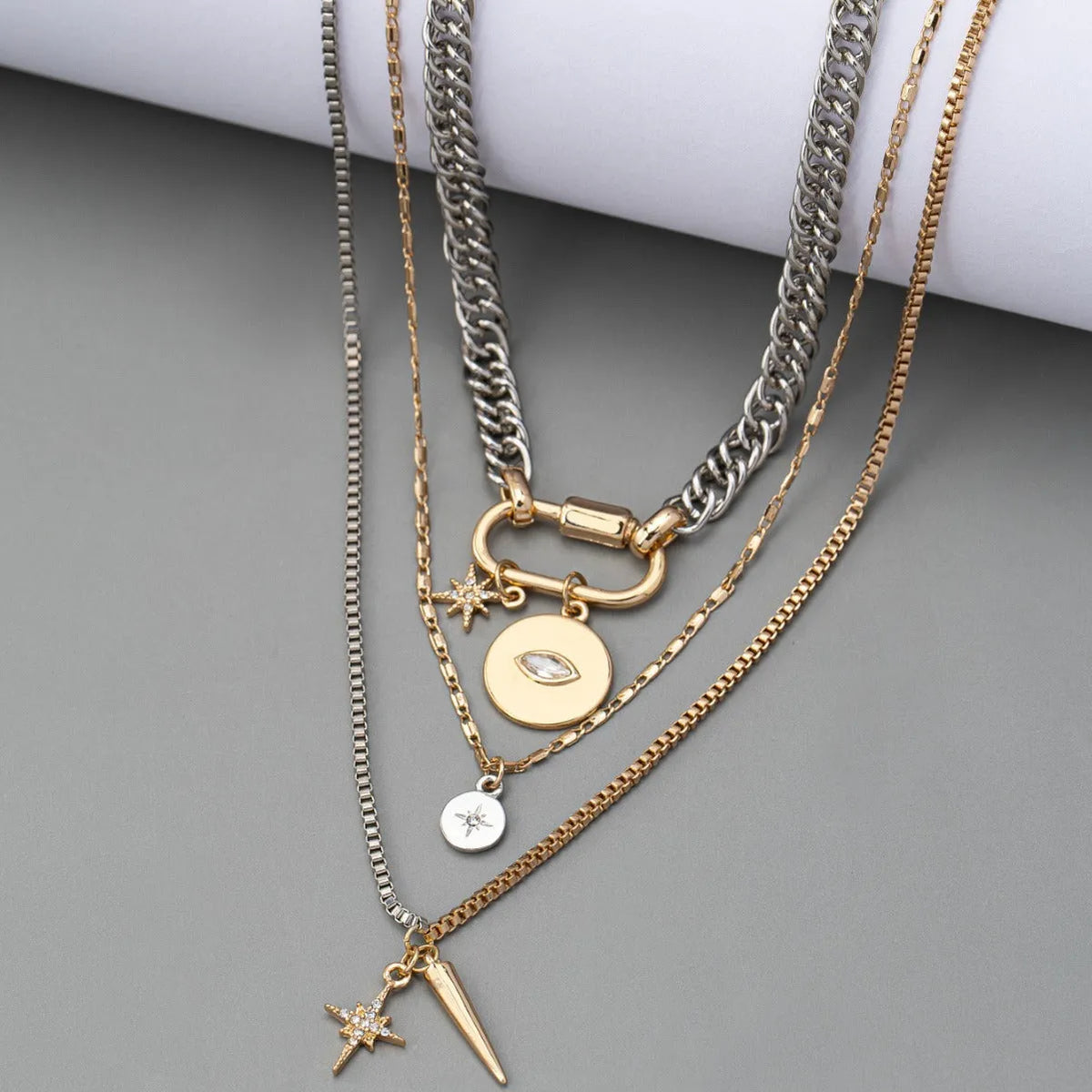 Eye pendant multi-layer twin necklace for women with alloy electroplated clavicle chain and geometric ellipse shapes.