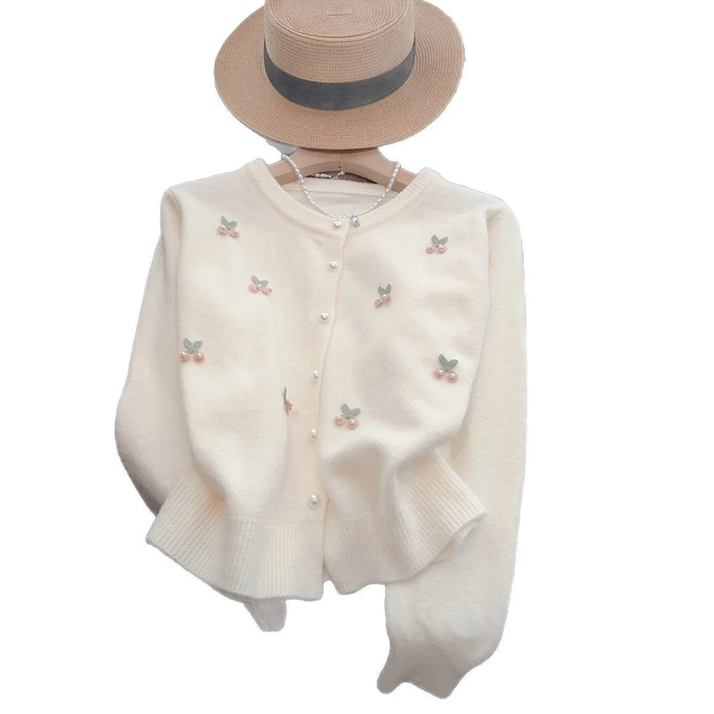 Women's slim fit cashmere blend cardigan coat with beaded details in blue, pink, red, and white.