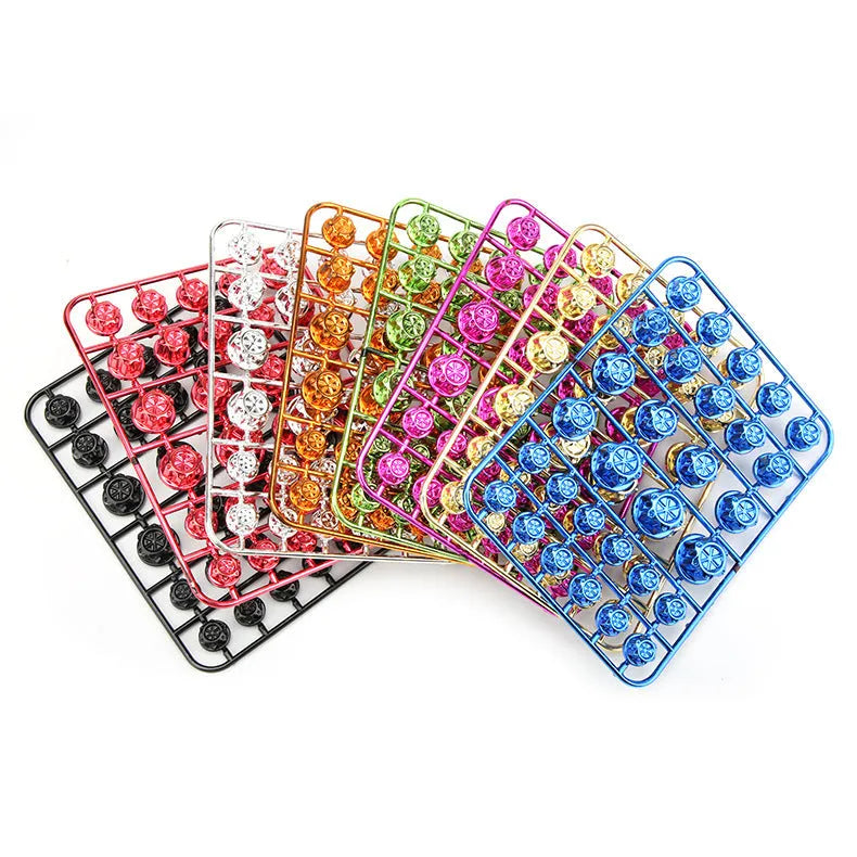 Set of 30 motorcycle engine screw caps in various colours including black, red, gold, blue, silver, green, orange, purple and yellow
