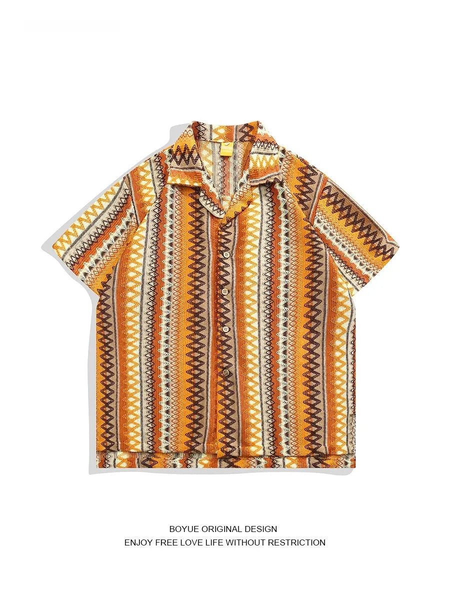 Man wearing a loose-fit ethnic style woven shirt with a Cuban collar and contrast colours.