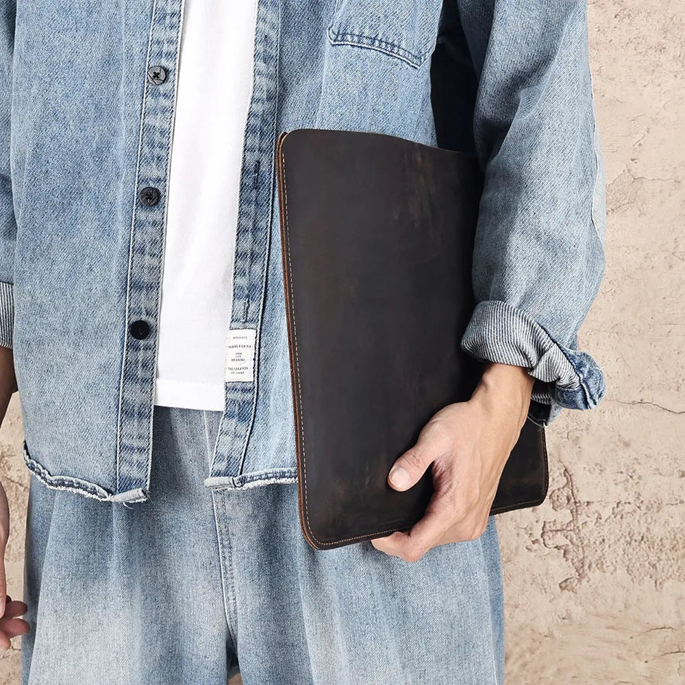 Men's brown Crazy Horse leather horizontal computer liner bag with compartments.