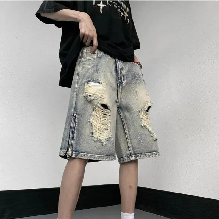 Blue retro-style denim shorts with a loose wide-leg cut and tattered detailing.