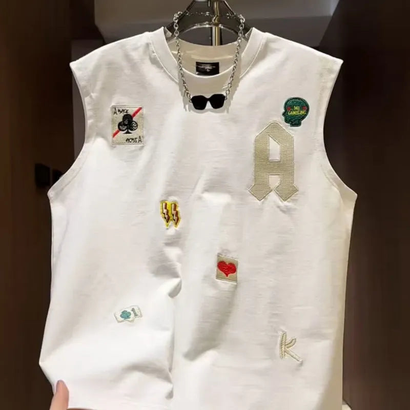 Men's white cotton sleeveless vest with a cartoon graphic print, shown on a hanger.