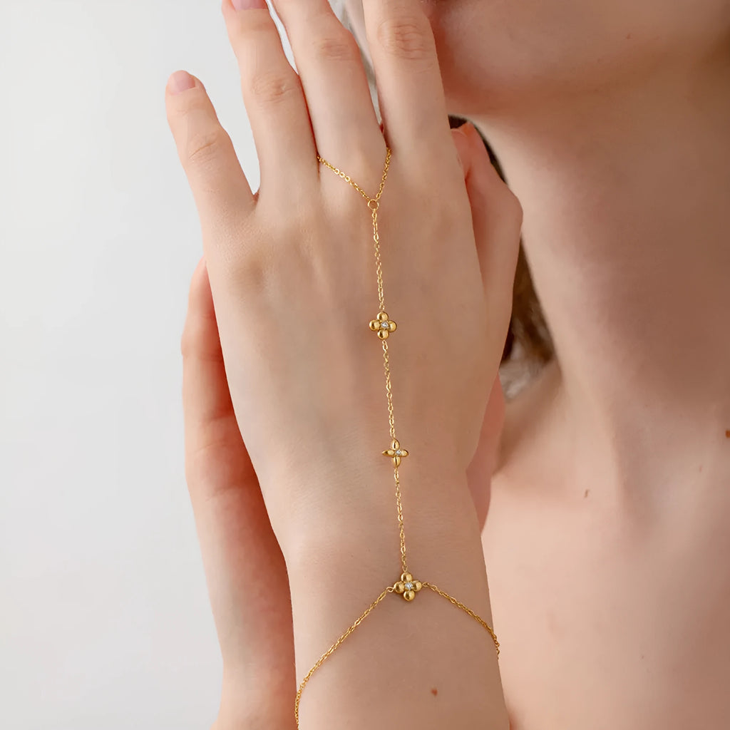 Women's gold stainless steel bracelet with eight-pointed stars and floral geometric design