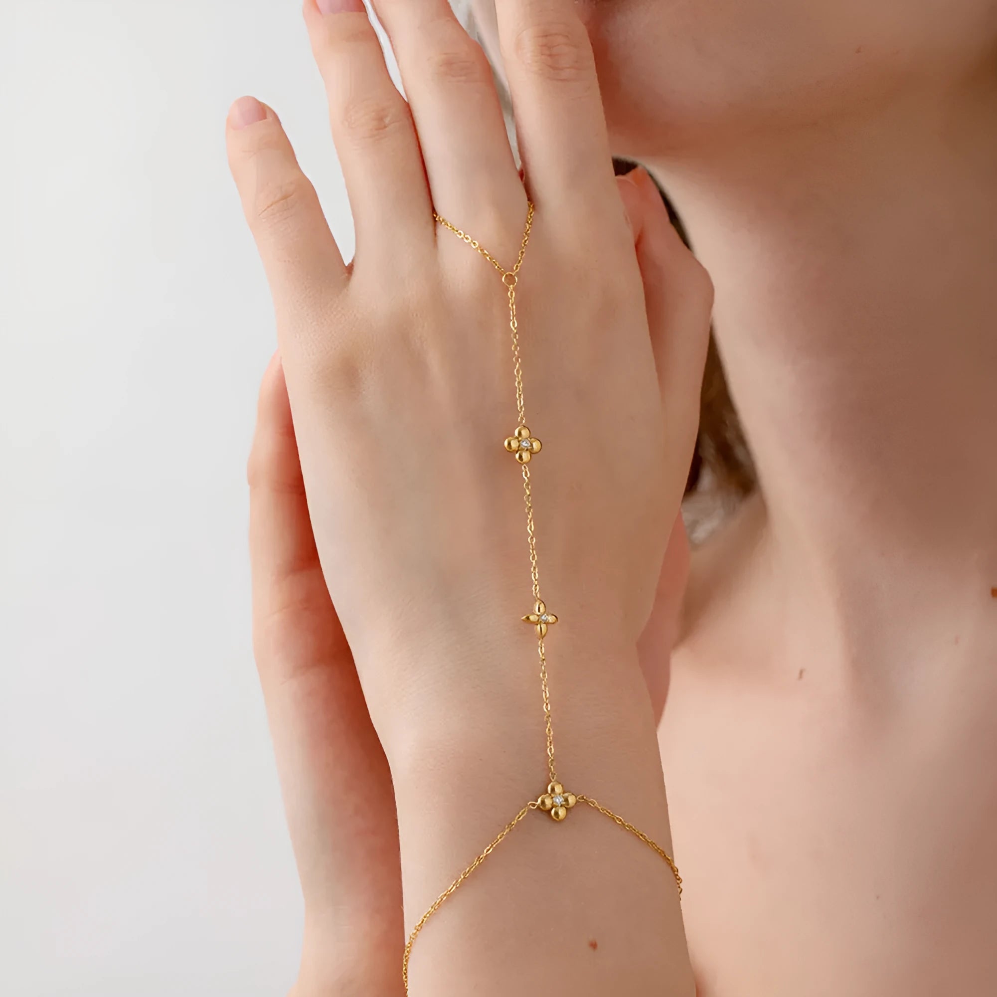 Women's gold stainless steel bracelet with eight-pointed stars and floral geometric design