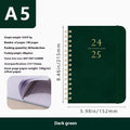 A5 leather notebook with metal coil binding in various colours including black, blue, and green.