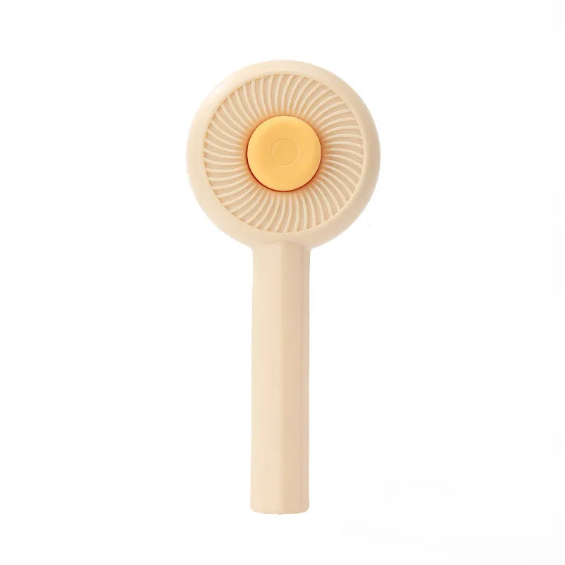Blue and yellow pet deshedding brush with metal pins and a self-cleaning button on the handle.
