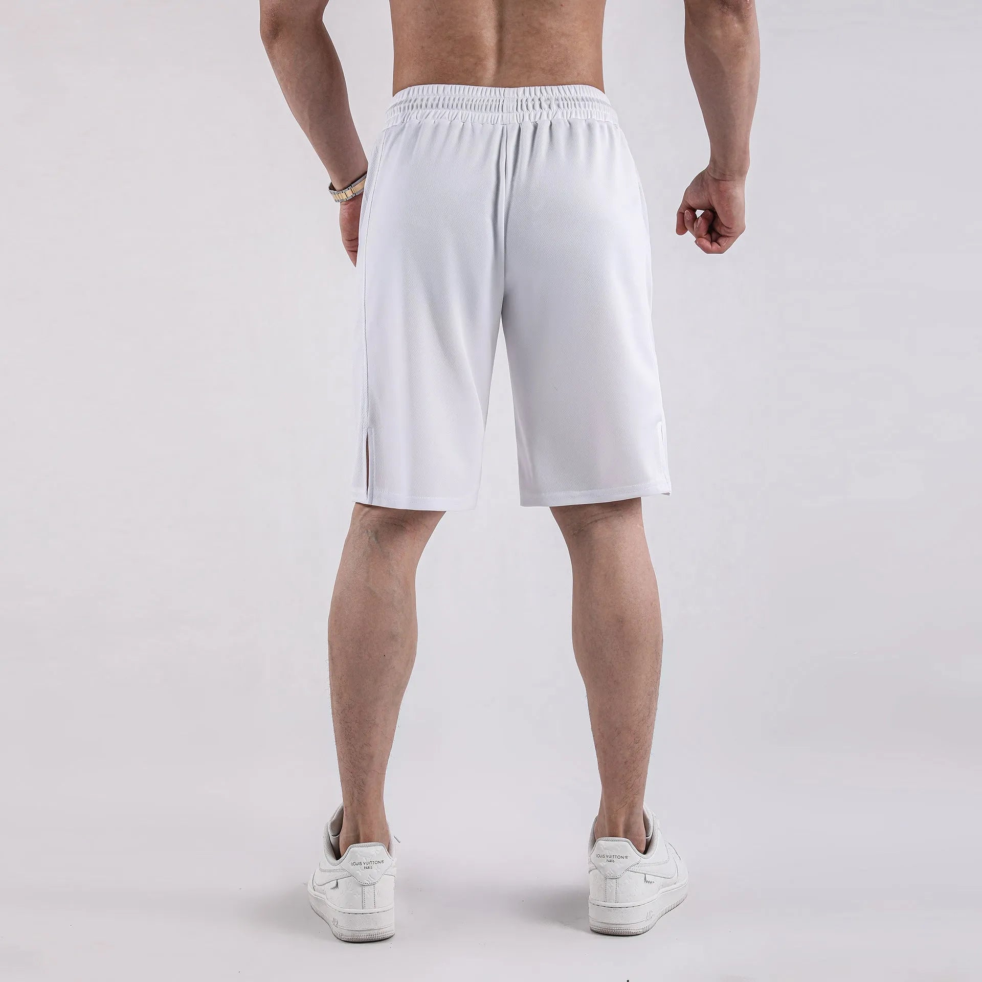 Men's black quick-drying mesh shorts with elastic waistband, shown in a loose casual fit.