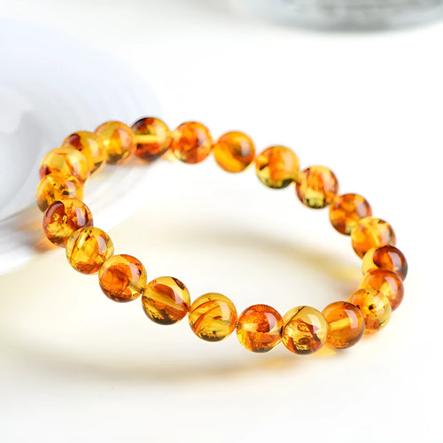 Natural yellow piebald amber bracelet with geometric beads for water purification