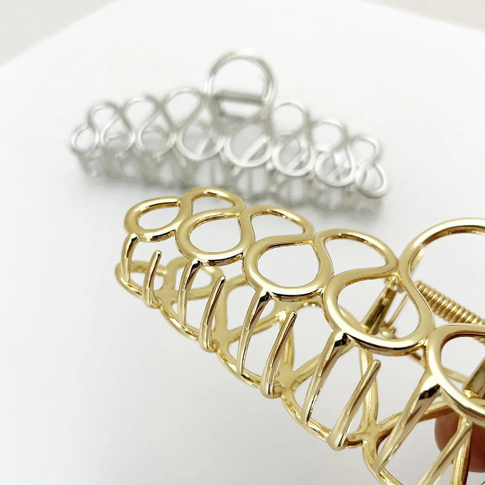 Gold or silver large alloy hair clip with tassel detail for women's updos