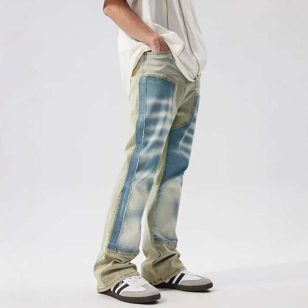 Yellow and blue retro patchwork splash-ink damaged design jeans on a mid-waist fit.