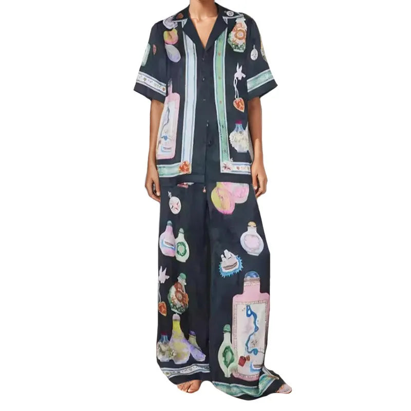 Black women's casual set with anime cartoon print, featuring a long sleeve cardigan and matching trousers.