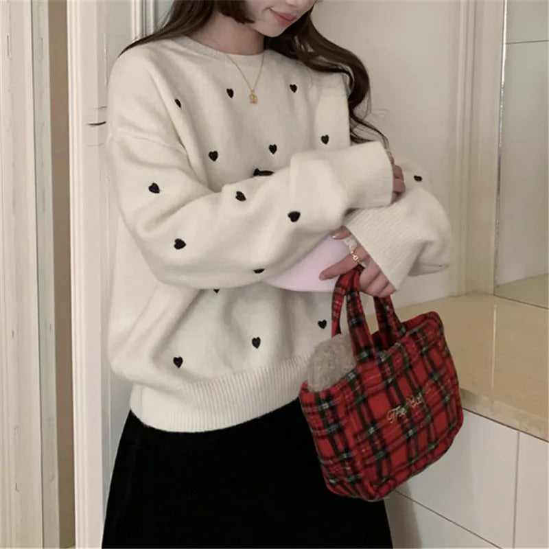 Women's loose fit acrylic pullover sweater with embroidery detail in milky white, grey, or pink.