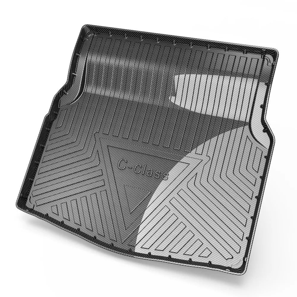 Black TPE car boot liner with carbon fibre texture pattern for specific vehicle models.