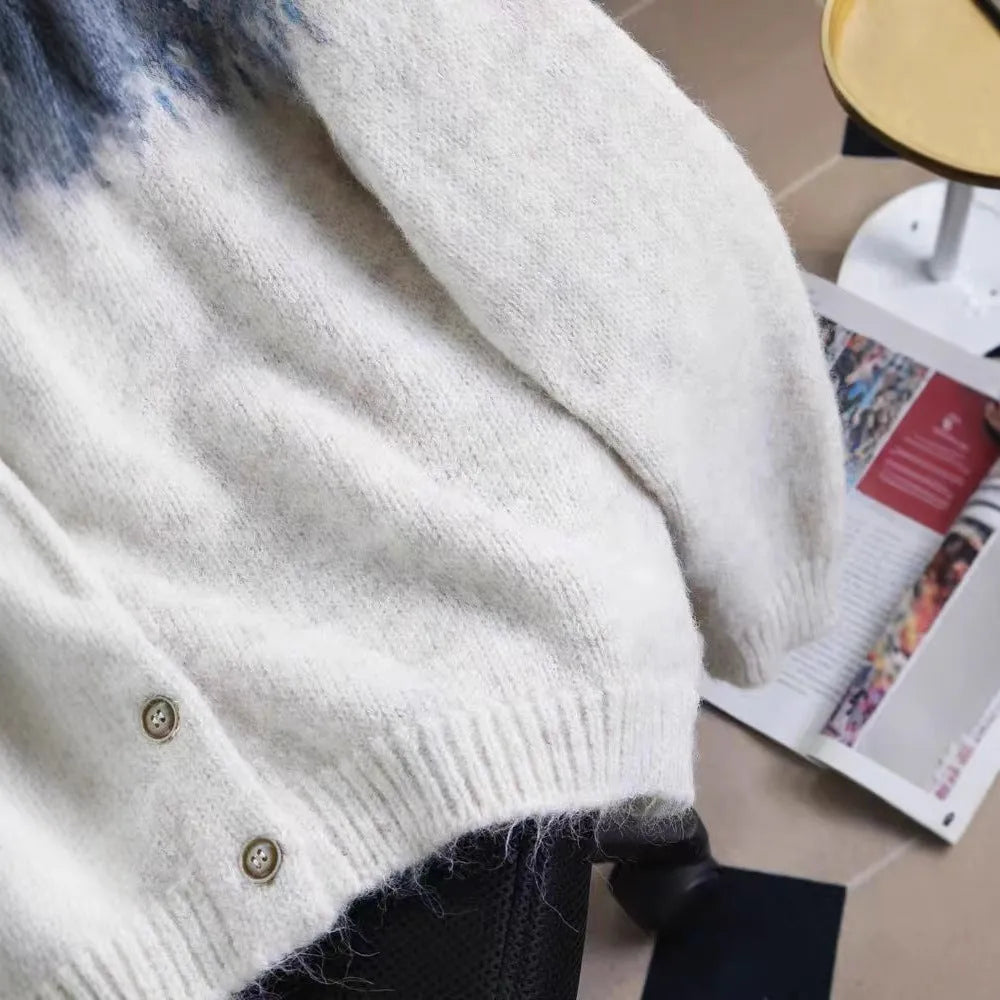 Women's loose-fit jacquard knit sweater coat in milky white, shown on a hanger.