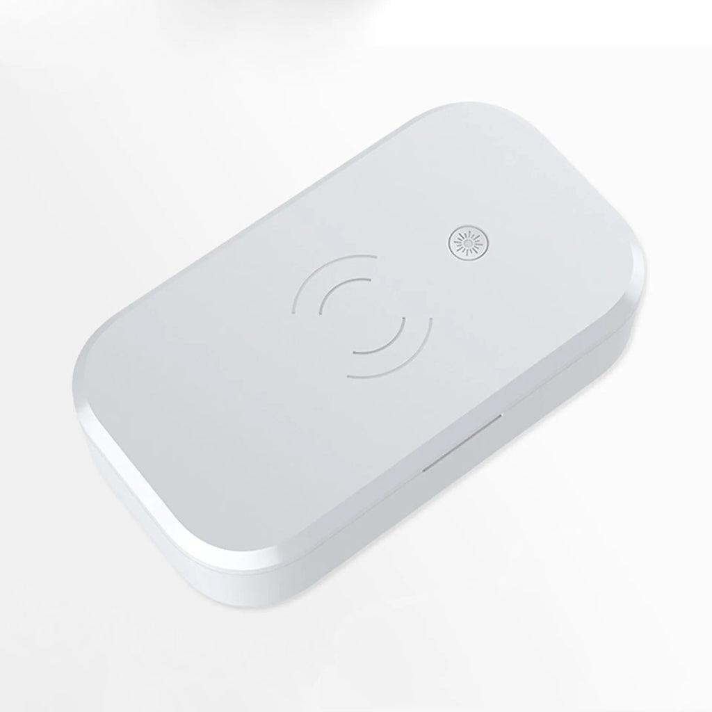 A white multifunctional UV disinfection box with wireless charging for mobile phones and nail tools.