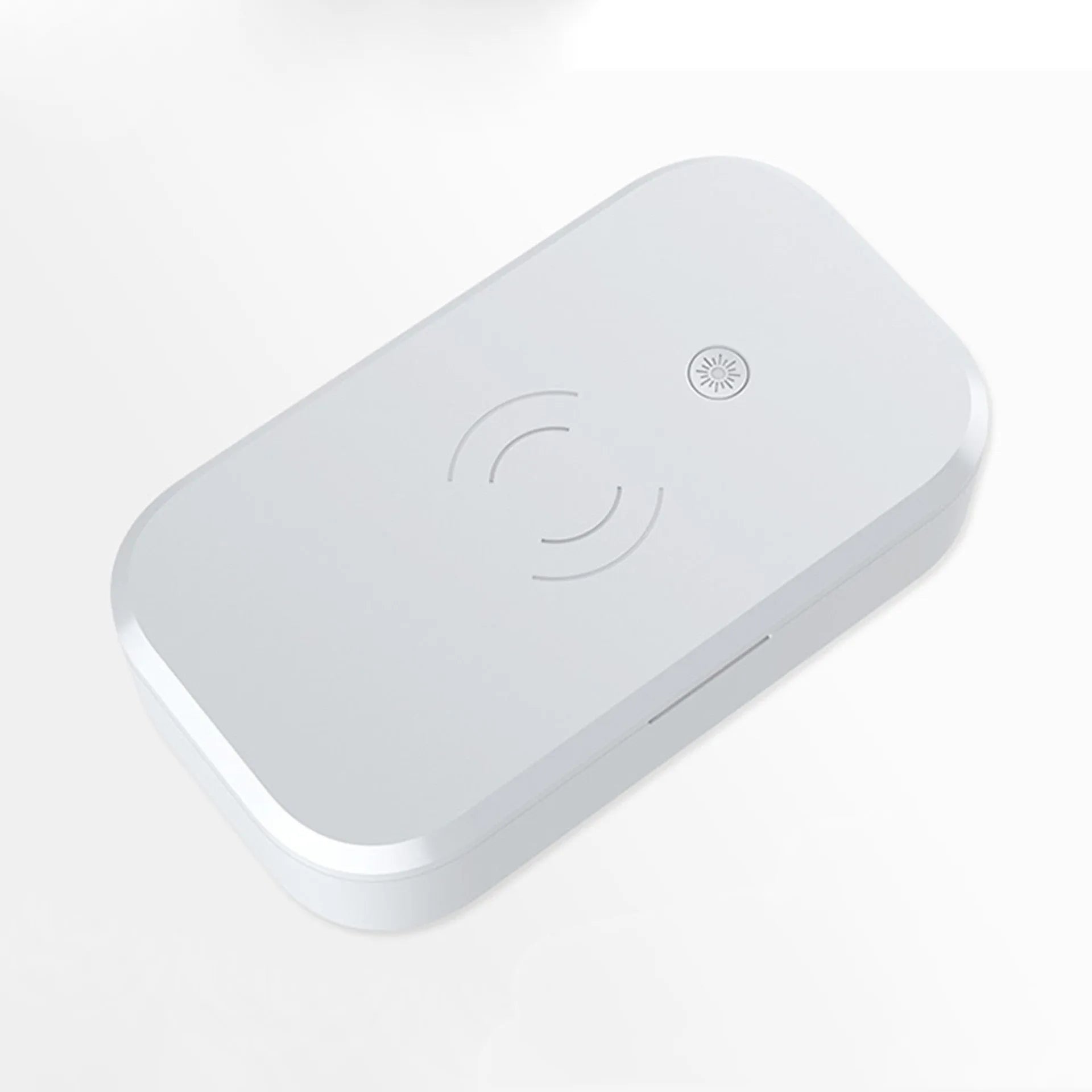A white multifunctional UV disinfection box with wireless charging for mobile phones and nail tools.