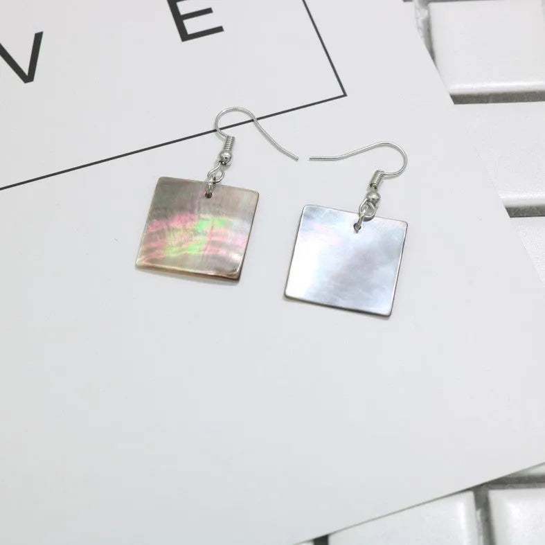 Women's geometric shell earrings in square panther or rectangular shell designs with natural material