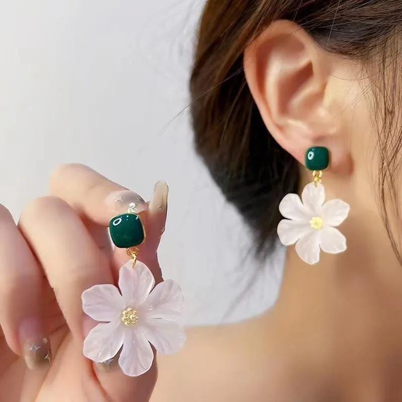 Dark green alloy earrings with sterling silver finish and sweet flower needle design